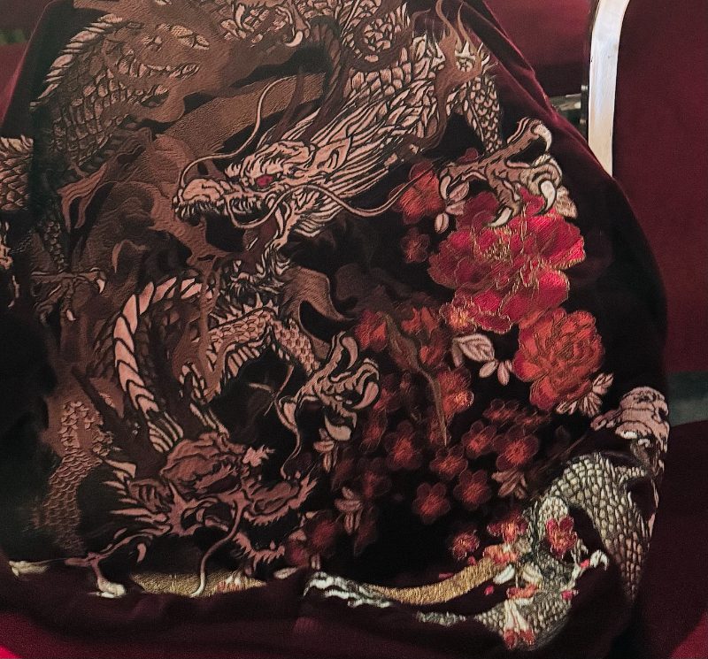 Embroidered dragon and red peonies on dark velvet