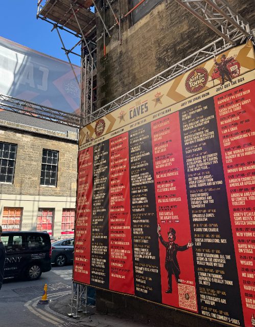 The Just the Tonic listings wall at The Caves, Venue 88